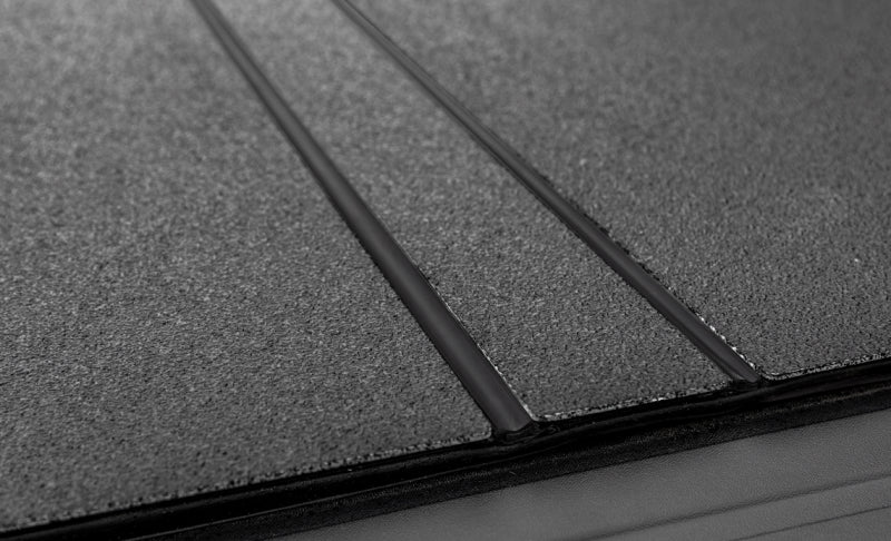 Access 2022+ Rivian R1T 4ft 6in Bed (w/ OEM Tonneau Track) LOMAX Folding Hard Cover - Black Urethane