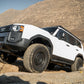 DV8 Offroad 24-25 Toyota Land Cruiser OE Plus Side Steps - Black Steel