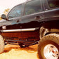 N-Fab Nerf Step 00-06 Chevy-GMC Tahoe/Yukon/Sonora SUV 4 Door - Gloss Black - W2W - 3in